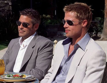 george clooney and brad pitt at a table